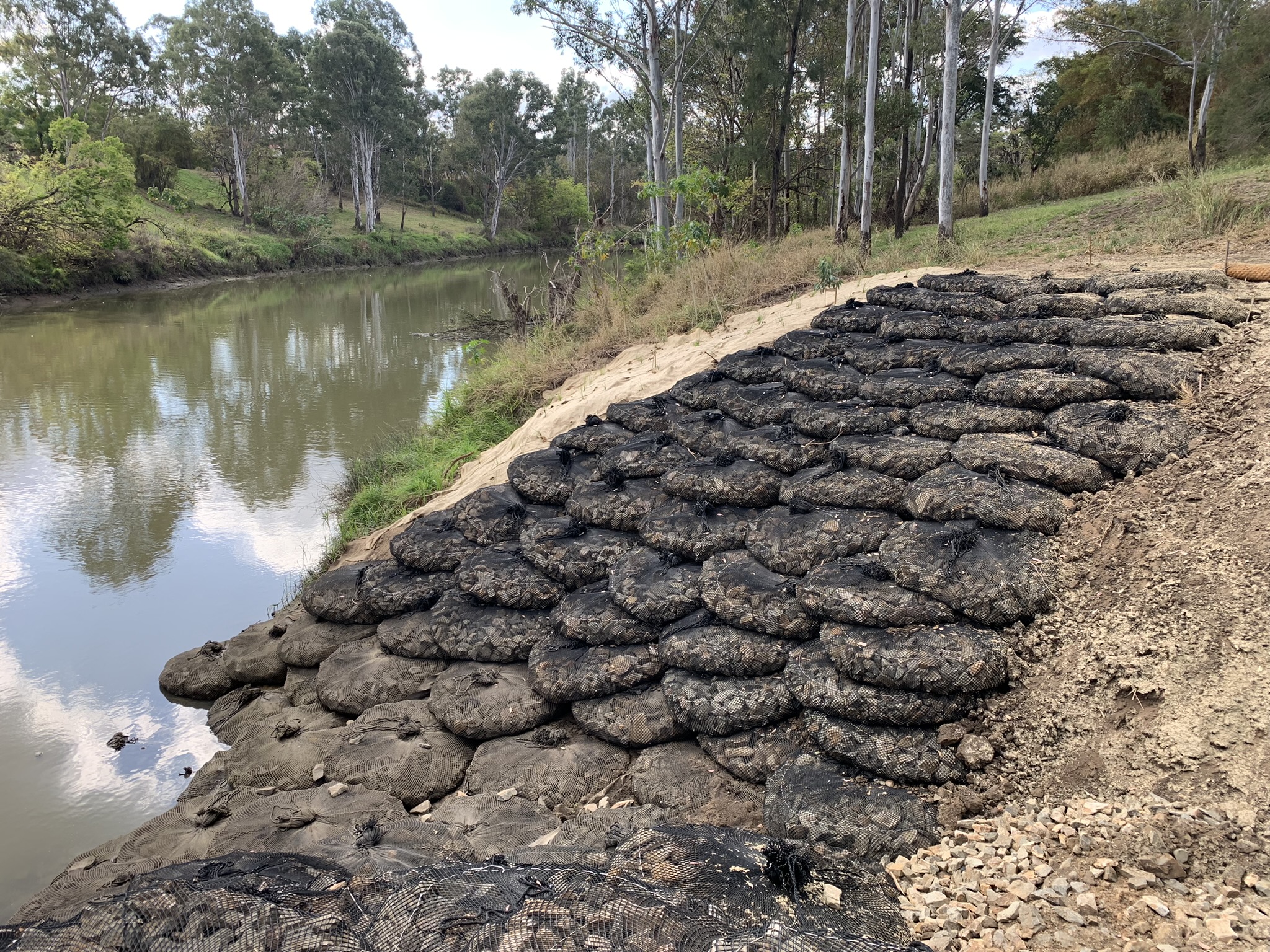 erosion control, scout protection, rock armoring, coastal resilience, environmental and infrastructure protection, gabion cage wall
